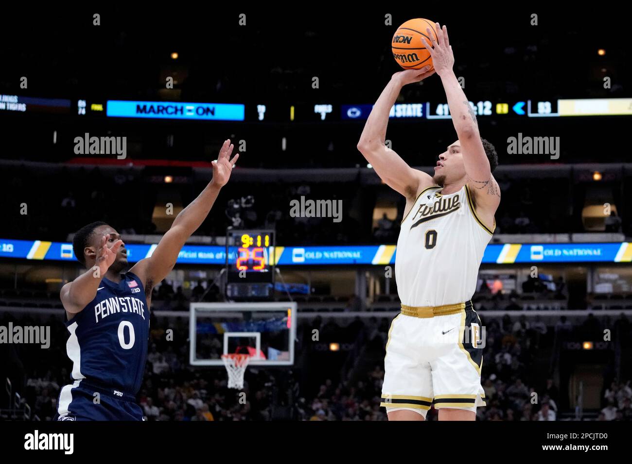 Purdue forward Mason Gillis, right, shoots over Penn State guard Kanye