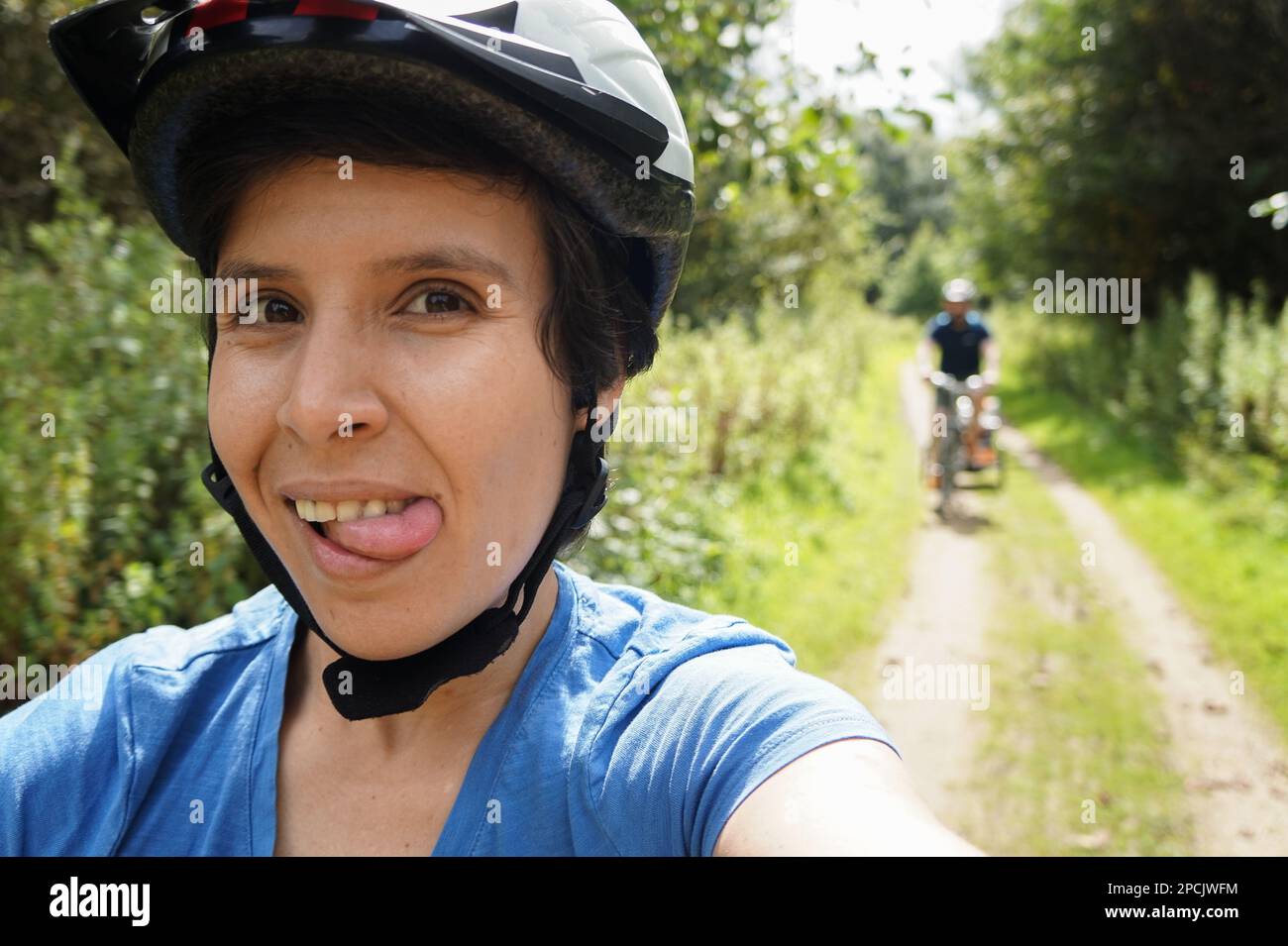 Girl having fun riding a bike Stock Photo