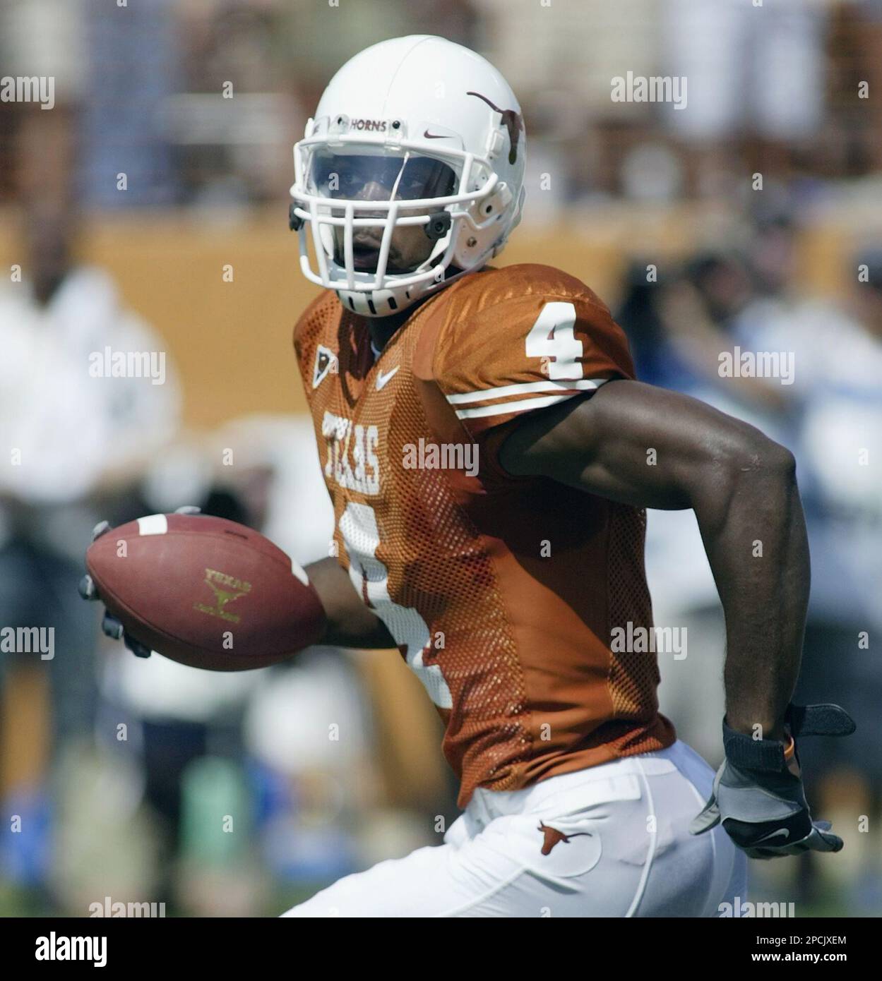 Texas wide receiver Limas Sweed (4) runs into the end zone to score as  Oklahoma defensive back D.J. Wolfe pursues in the third quarter of their  college football game, Saturday, Oct. 7