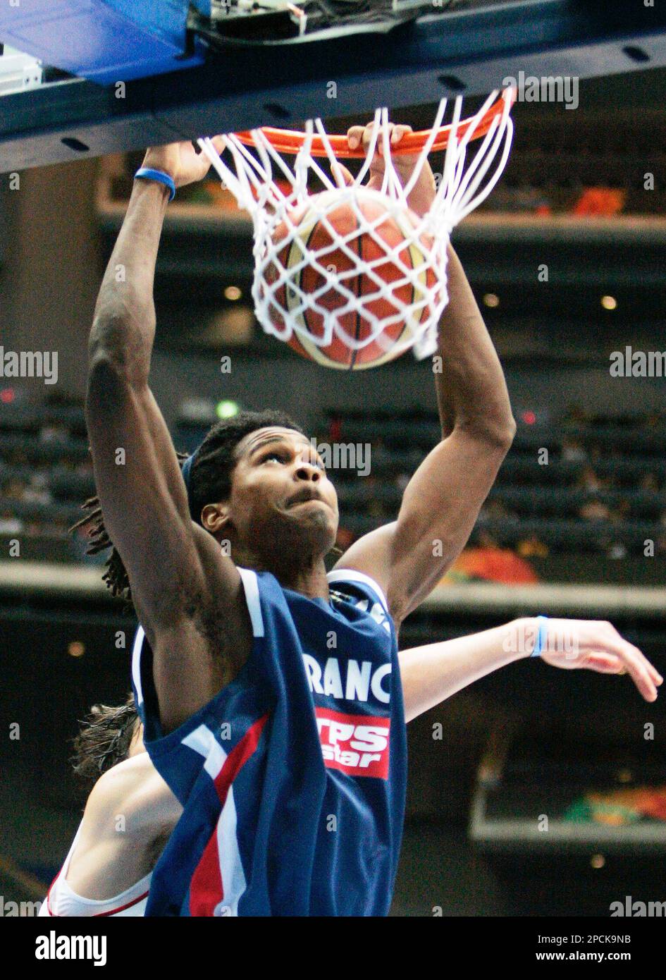 France's Mickael Gelabale (5) dunks during their game against Turkeyduring  the 5-6th place final in the World Basketball Championships in Saitama,  Japan, Saturday, Sept. 2, 2006. France won the match 64-56. (AP