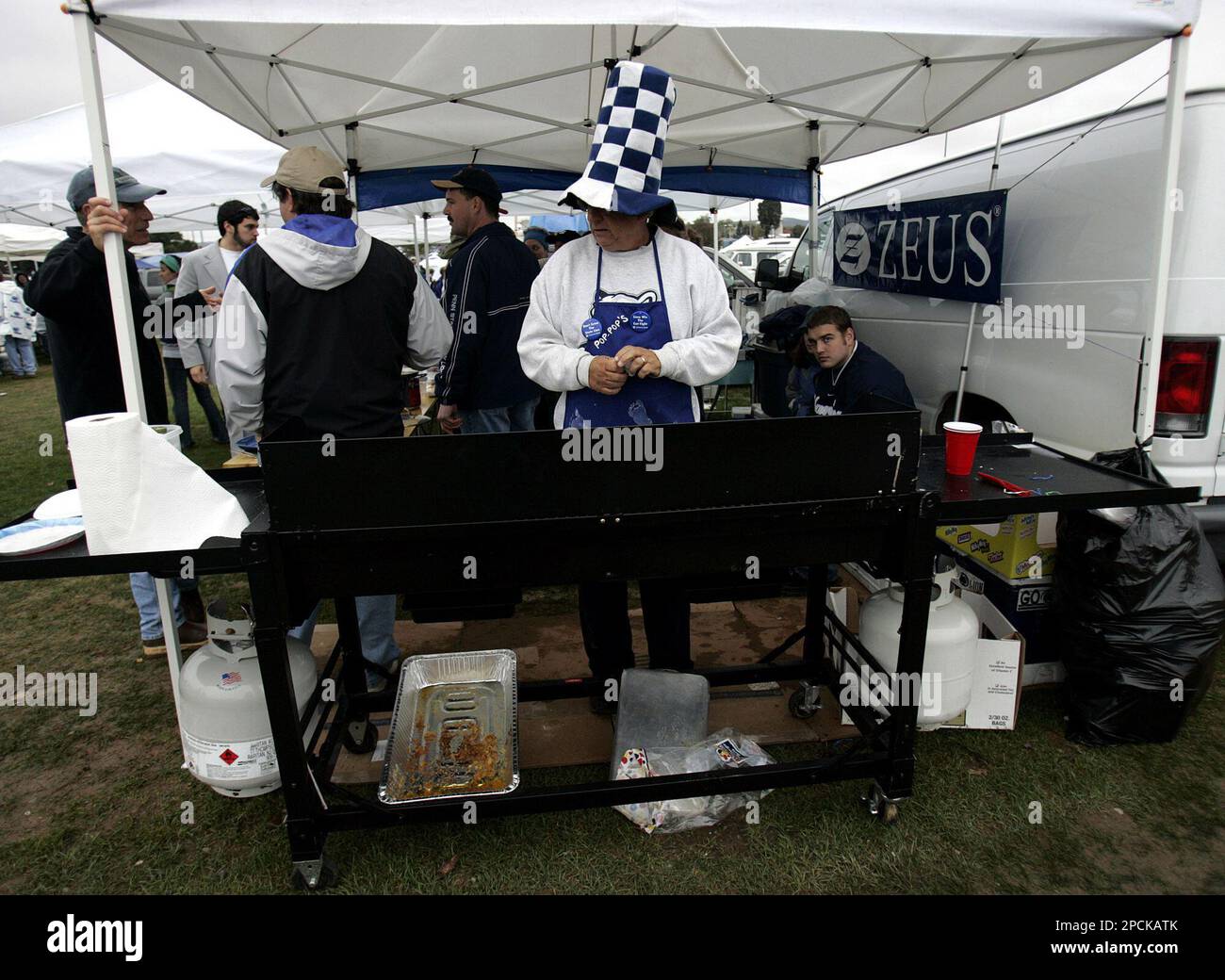 FILE ** Bob Correll, of Harrisburg, Pa., sports a large blue and white hat  while tailgating in the Beaver Stadium parking lot before a Penn State  football game in State College,, image size:1300x1040