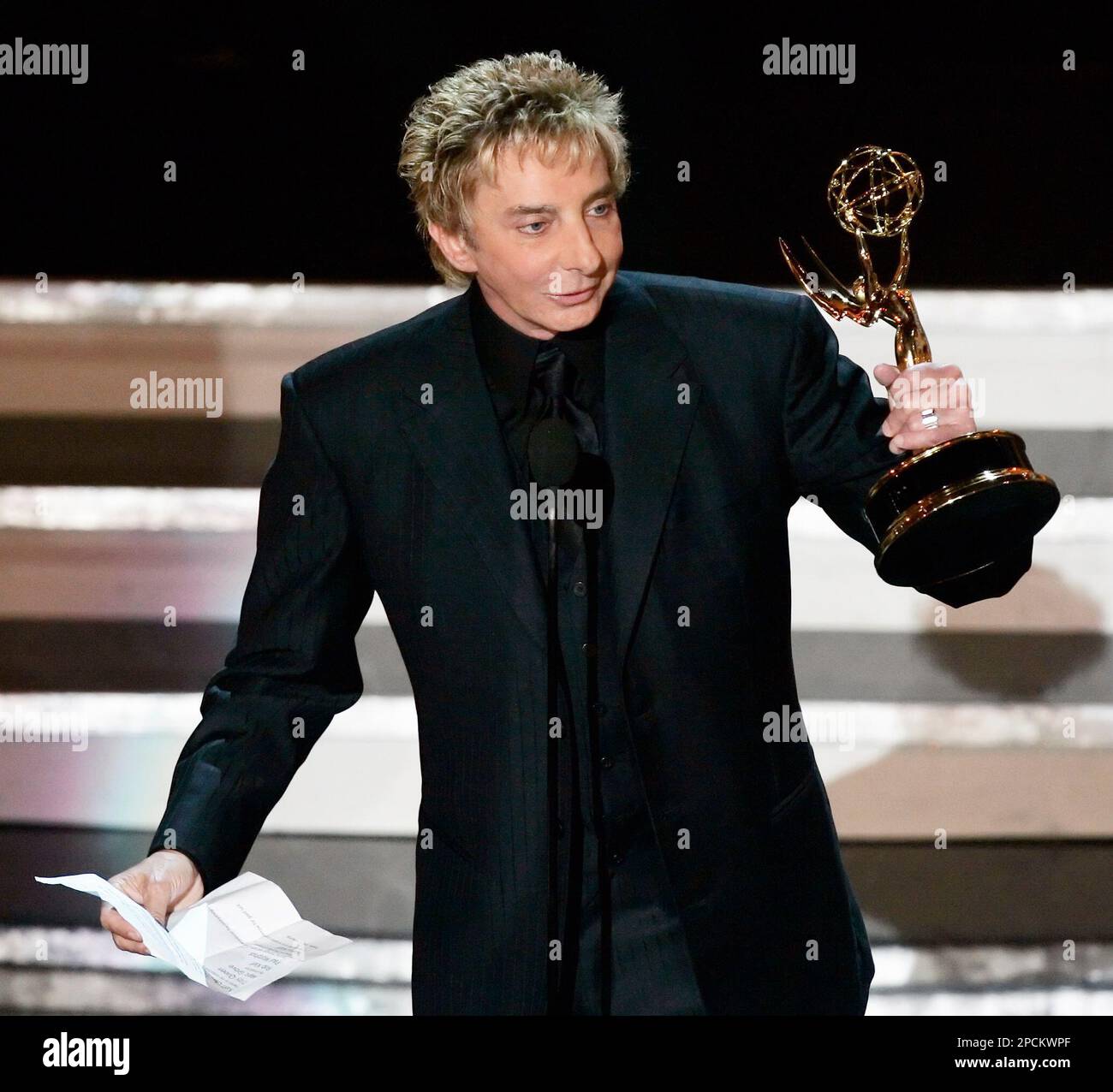 Barry Manilow accepts the award for outstanding individual performance in a  variety or music program for his work on "Barry Manilow: Music and Passion"  at the 58th Annual Primetime Emmy Awards Sunday,