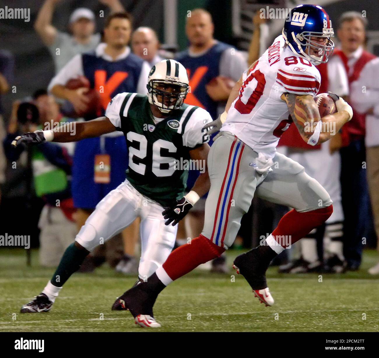 New York Giants Jeremy Shockey and Eli Manning (right) watch the action  from the bench in the fourth quarter. The Vikings defeated the Giants  41-17, at Giants Stadium in East Rutherford, New