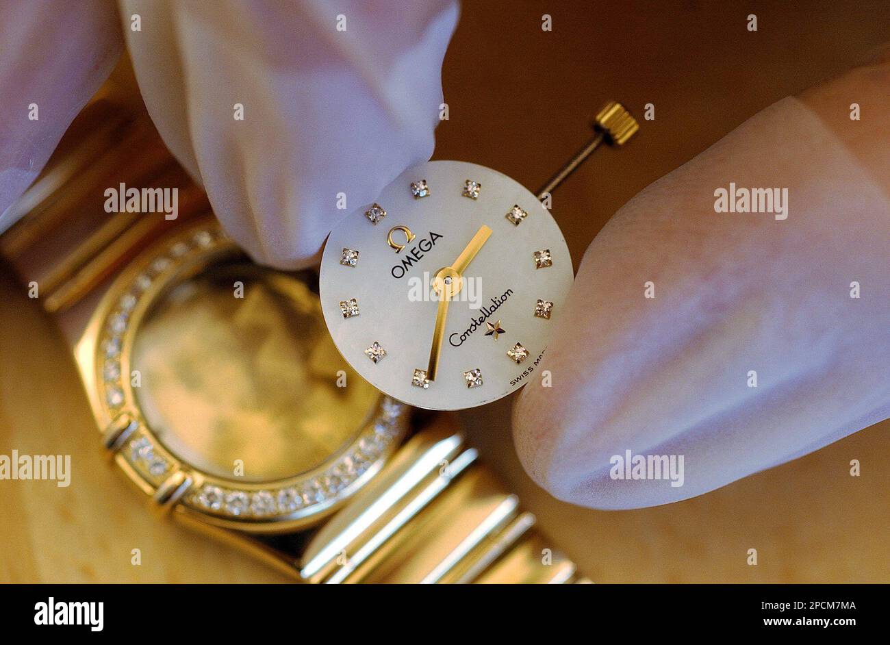FILE A watchmaker adjusts an Omega Constellation watch at the