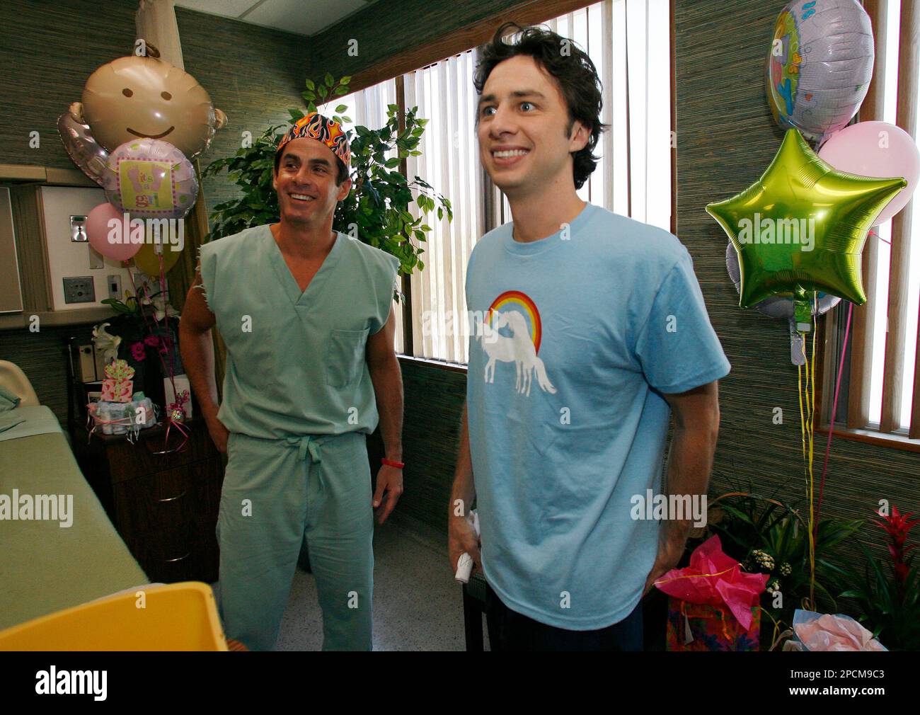 Actor Zach Braff, right, and actor Rob Maschio appear on the set of the