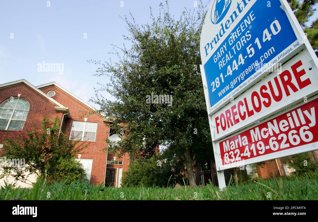 A foreclosure home for sale is shown Tuesday, Aug. 22, 2006 in Spring