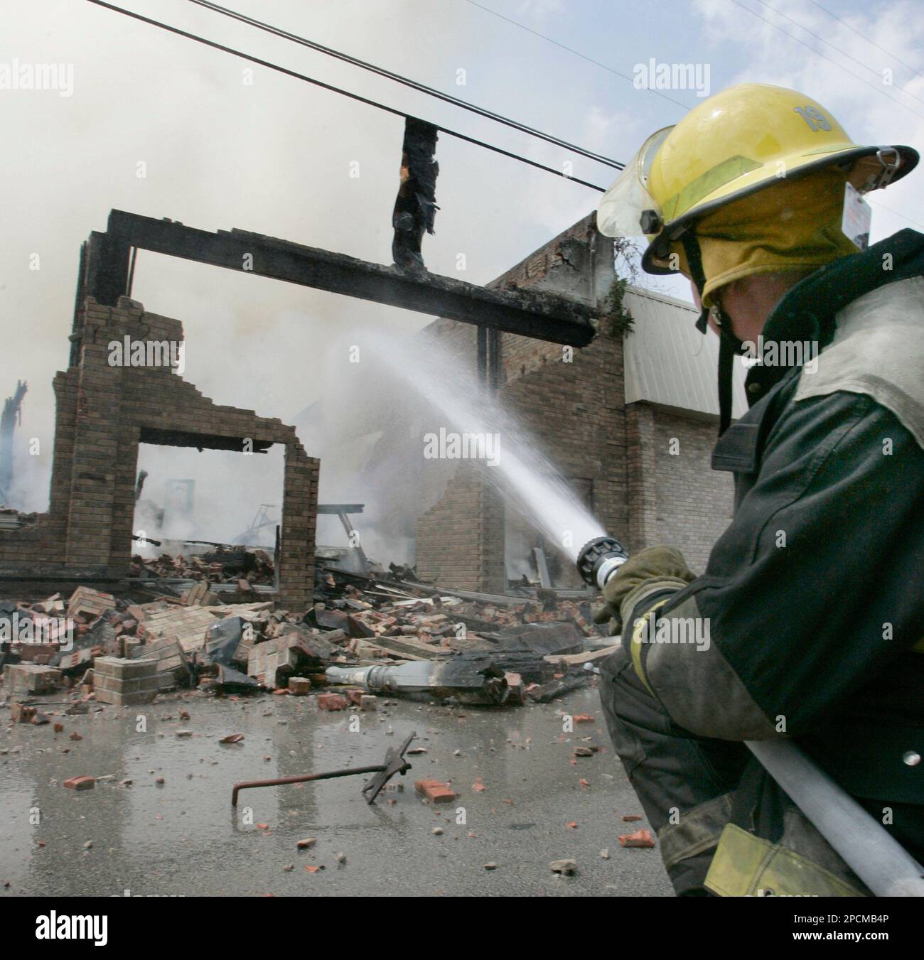 Firefighters from three volunteer departments use suppressant foam to  extinguish a fire in a salt water storage tank at a natural gas well near  Nacogdoches, Texas, on Tuesday, Dec. 4, 2012. Katie