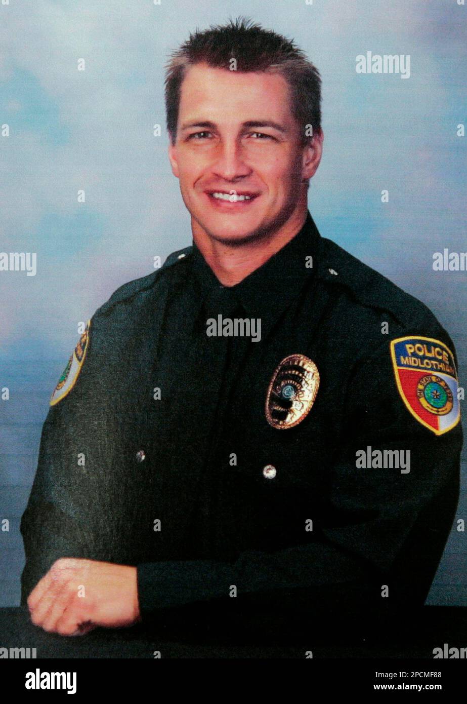 Midlothian Police officer Dustin Compton, 30, is seen in this undated