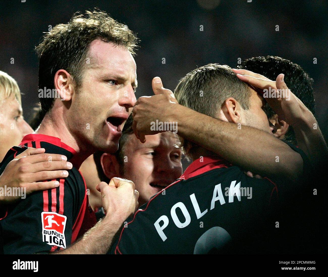 Nuremberg's Markus Schroth, left, celebrates with his teammates Ivan Saenko from Russia and Jan Polak from Czech Republic, from left, during the German first soccer division match between 1. FC Nuremberg and Borussia Moenchengladbach in Nuremberg's easy credit stadium, southern Germany, on Friday, Aug. 18, 2006. Nuremberg won the match 1-0. (AP Photo/Christof Stache)** NO MOBILE USE UNTIL 2 HOURS AFTER THE MATCH, WEBSITE USERS ARE OBLIGED TO COMPLY WITH DFL-RESTRICTIONS, SEE INSTRUCTIONS FOR DETAILS ** Stock Photo
