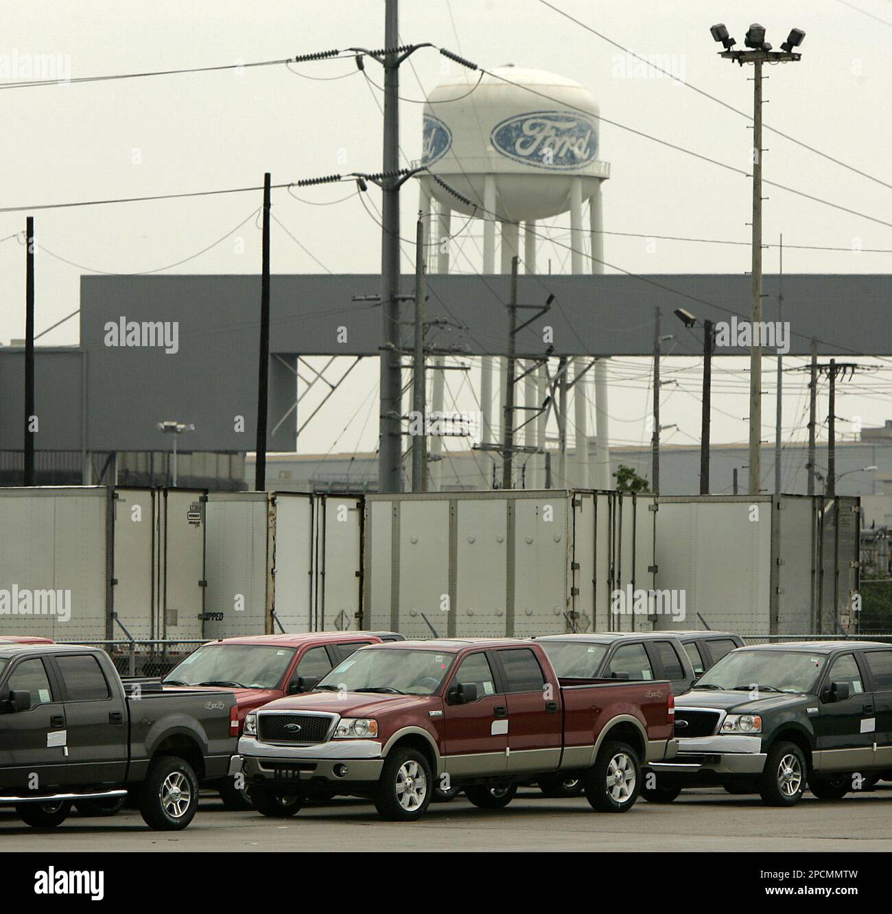 Ford pickups sit on a lot outside Ford's Kansas City Assembly Plant in  Claycomo, Mo. Friday, Aug. 18, 2006. Ford Motor Co. announced sharp cuts in  its 2006 North American production that