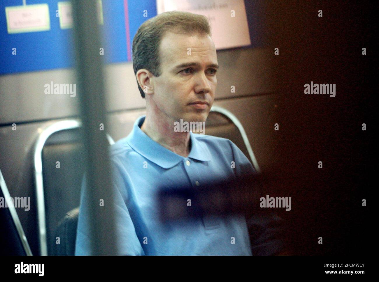 American John Mark Karr, sits in a room after a police news conference