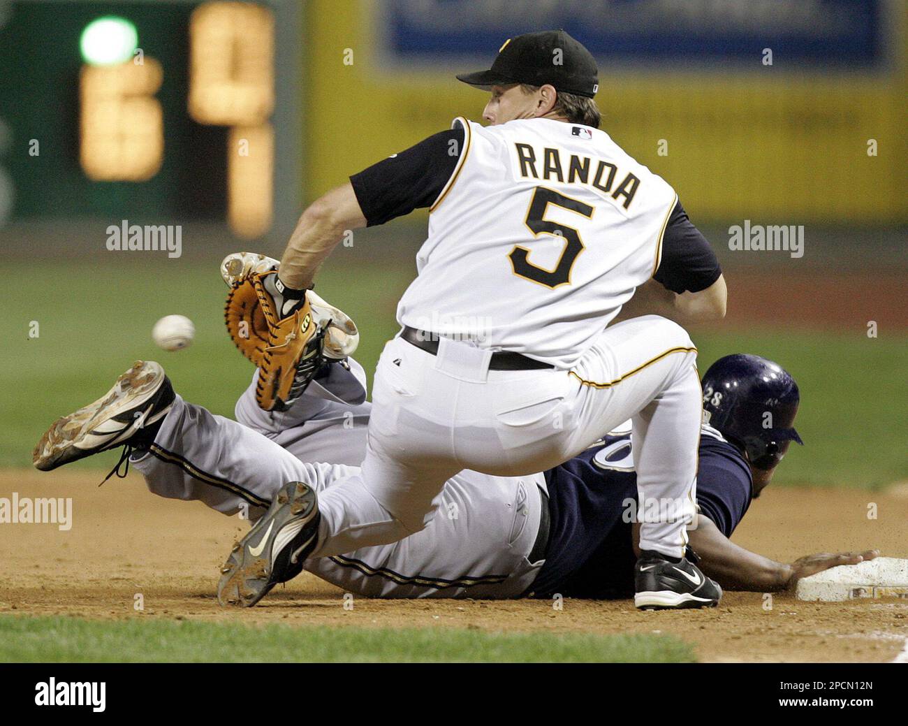 Milwaukee Brewers' Prince Fielder, bottom, beats the throw to Pittsburgh  Pirates first baseman Joe Randa to avoid being doubled off first on a line  drive to third by Kevin Mench in the