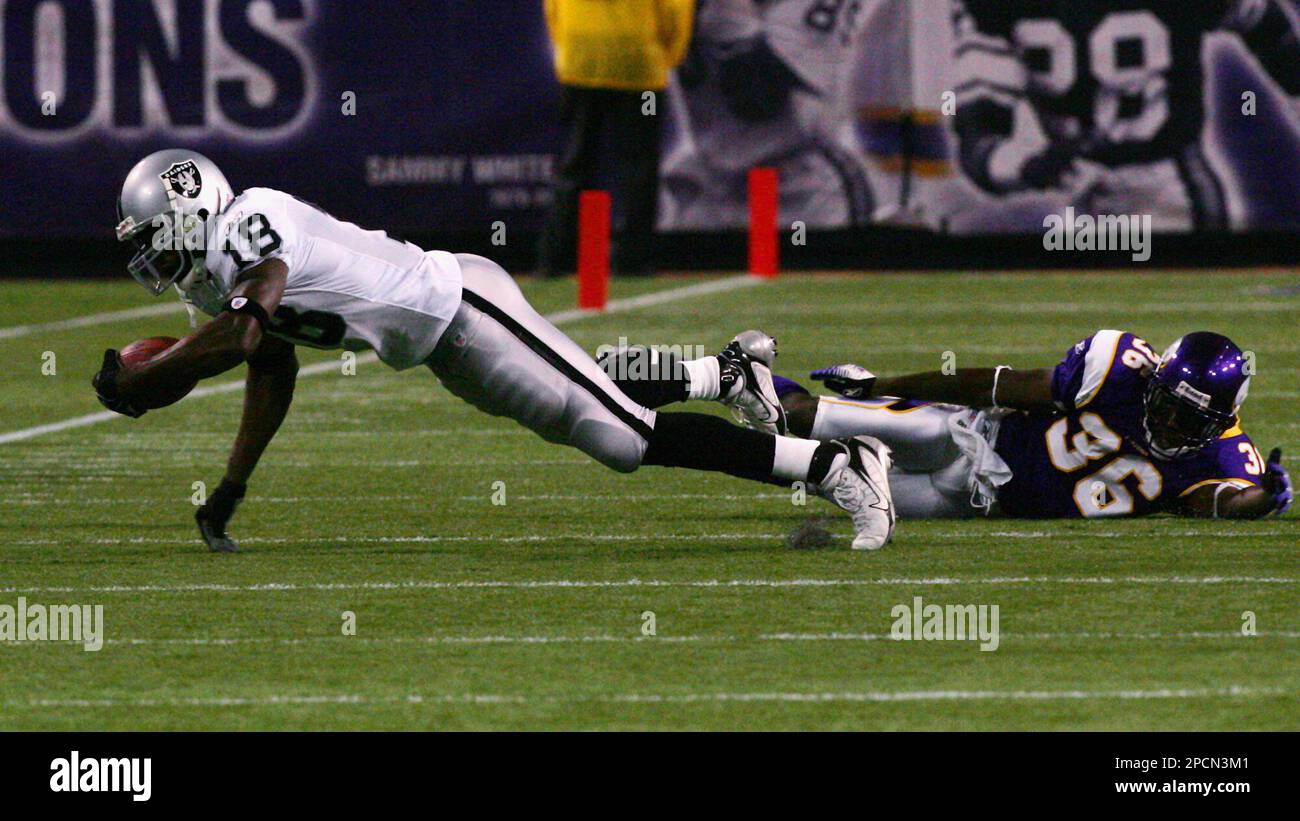 Dec 03, 2006; Oakland, CA, USA; Oakland Raiders wide receiver RANDY MOSS  can't catch a pass in the endzone sandwiched by Houston Texans cornerbacks  DEMARCUS FAGGINS (38) and DUNTA ROBINSON (23) with