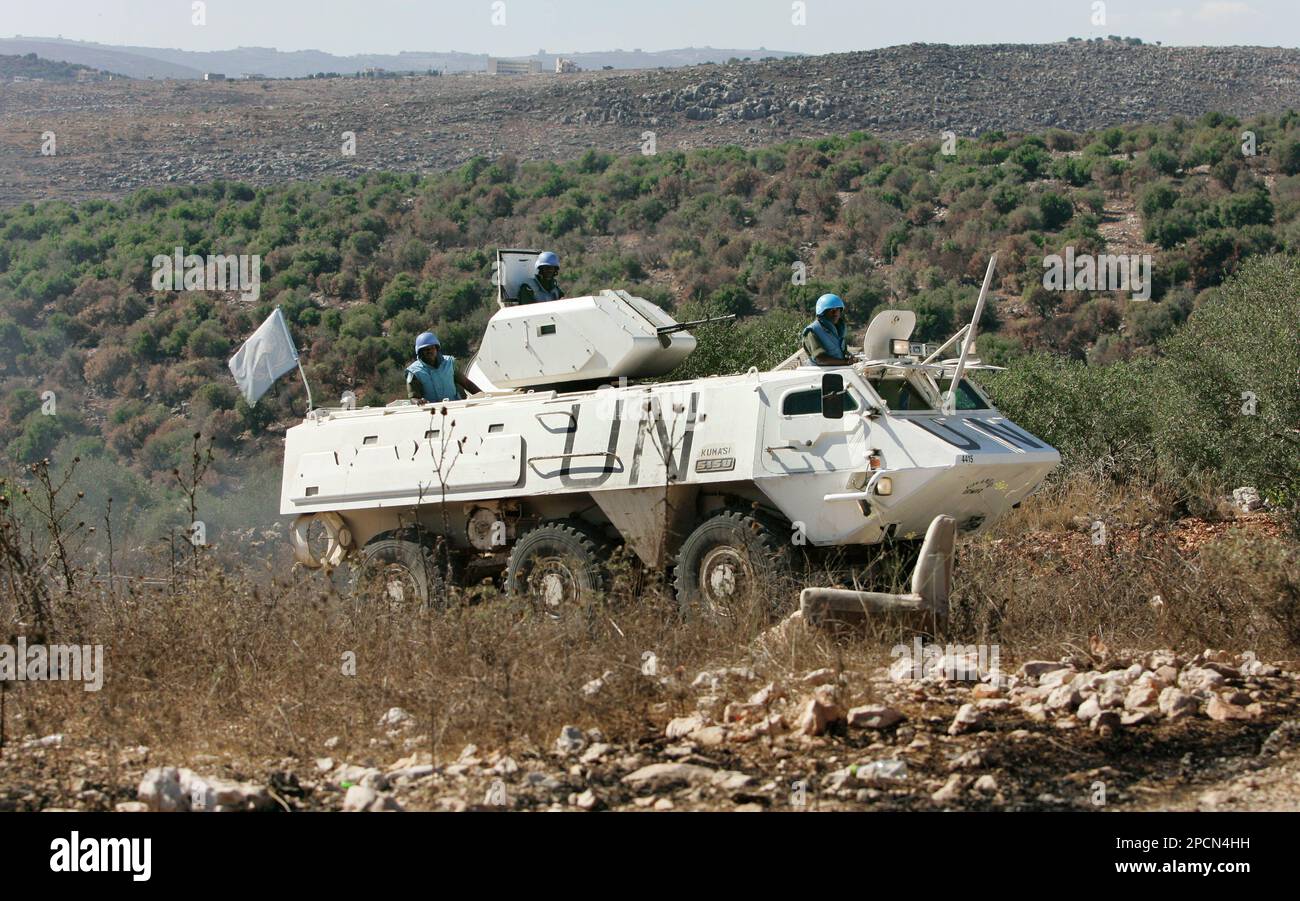 UN peacekeepers from Ghana patrol in an armoured vehicle on the road