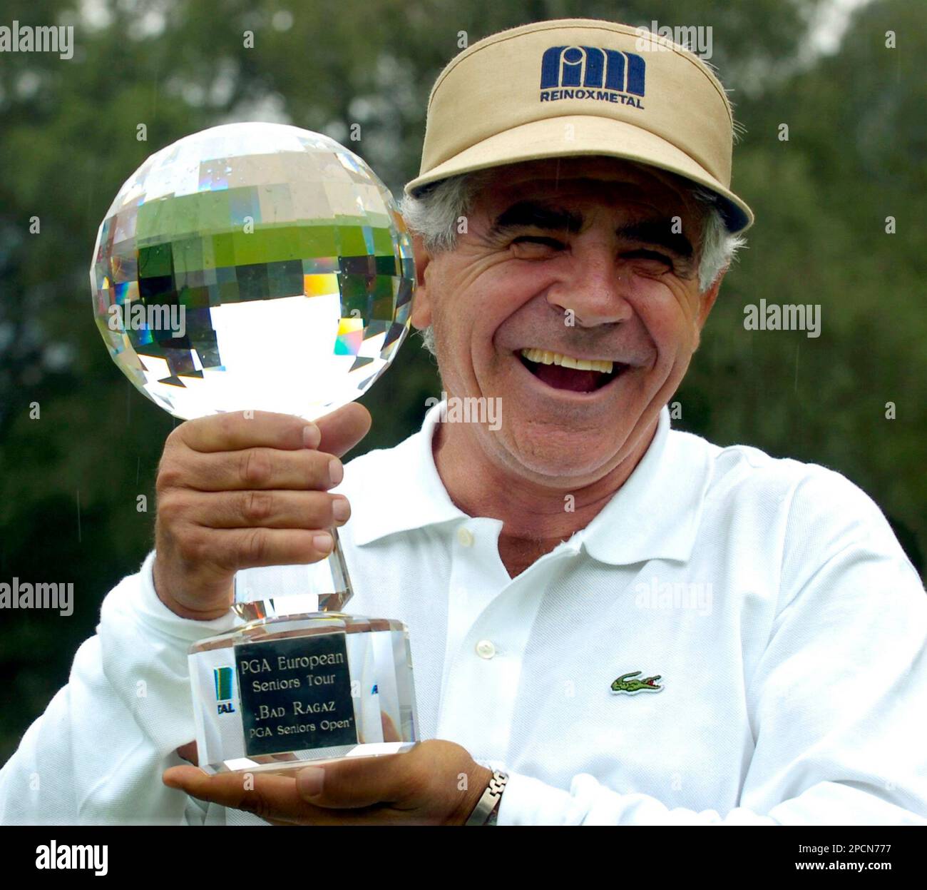 Juan Quiros holds the trophy after winning the PGA Golf Seniors Open in ...