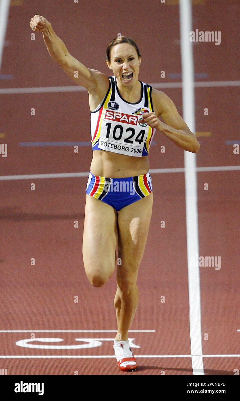 Belgium's Kim Gevaert celebrates as she crosses the finish line to win the gold medal in the Women's 200 meters during the European Athletics Championships in Goteborg, Sweden, Friday Aug. 11, 2006. (AP Photo/Jasper Juinen) Stock Photo