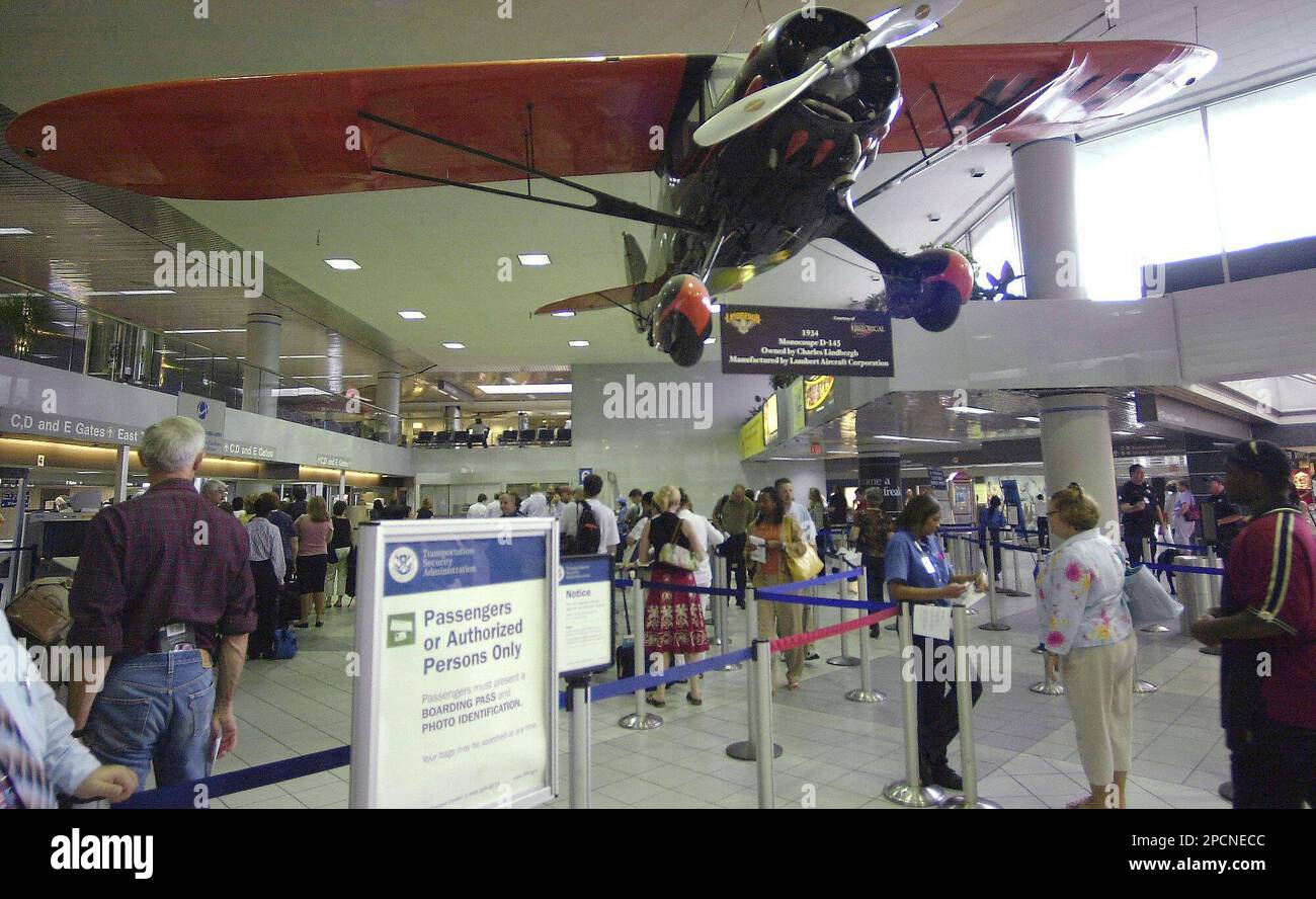 Airline passengers move through security at Lambert International 