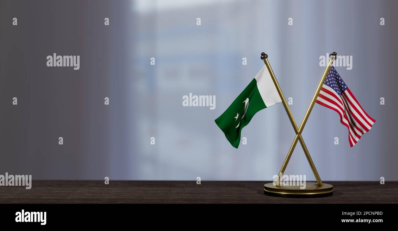 Pakistan and USA flags on table. Negotiation between Pakistan and United States. on little blur background. 3D work and 3D image Stock Photo