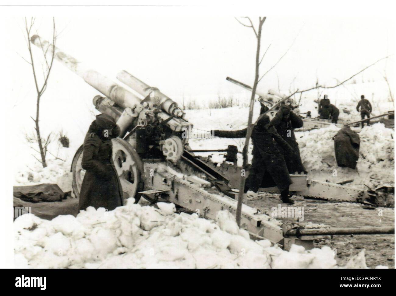 World War Two B&W photo Wehrmacht Troops using heavy Artillery during the Winter of 1942 on the Russian Front . Stock Photo