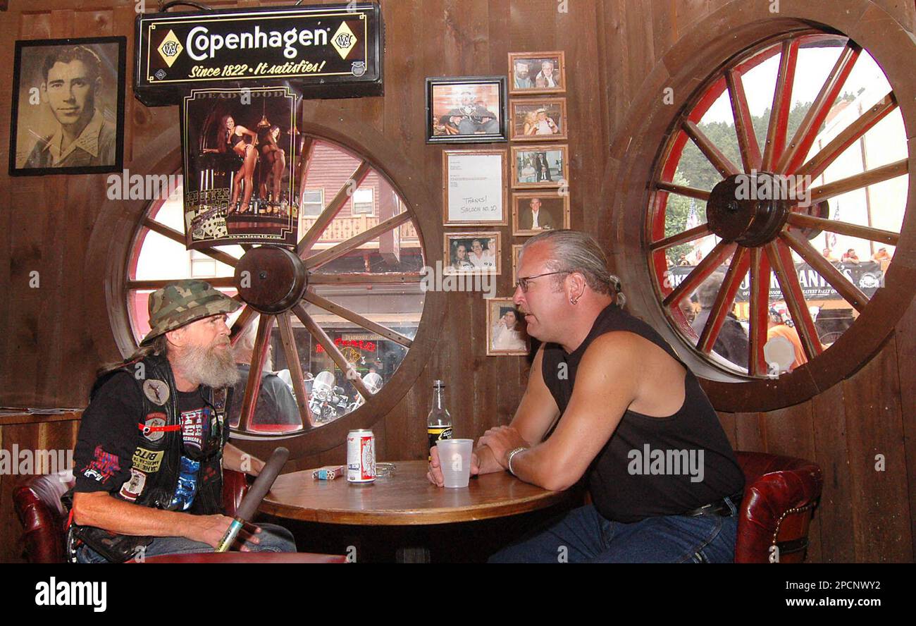 John Rockefeller, left, and Rick Way, both of Denver, Colo. visit over ...