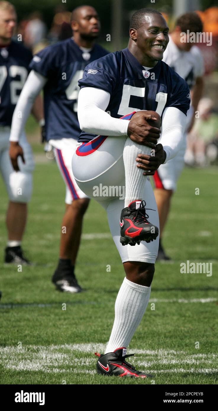 Buffalo Bills free safety Troy Vincent, left, and linebacker Takeo Spikes,  right, watch football practice inside the fieldhouse at Ralph Wilson  Stadium in Orchard Park, N.Y., Wednesday, Sept. 13, 2006. Spikes and