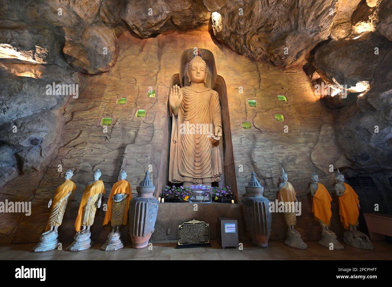 Custom-made grotto at the foot of the Golden Mount, Wat Saket, Bangkok, with replica of Afghan Bamiyan Buddha statue Stock Photo