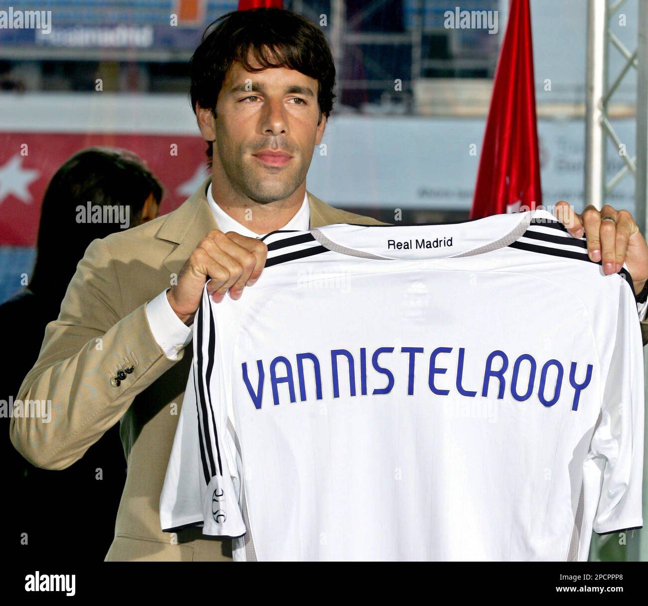 Ruud van Nistelrooy of the Netherlands holds up his new Real Madrid shirt  during his official presentation at the Bernabeu stadium in Madrid, Friday,  July 28, 2006. Van Nistelrooy, formerly of Manchester