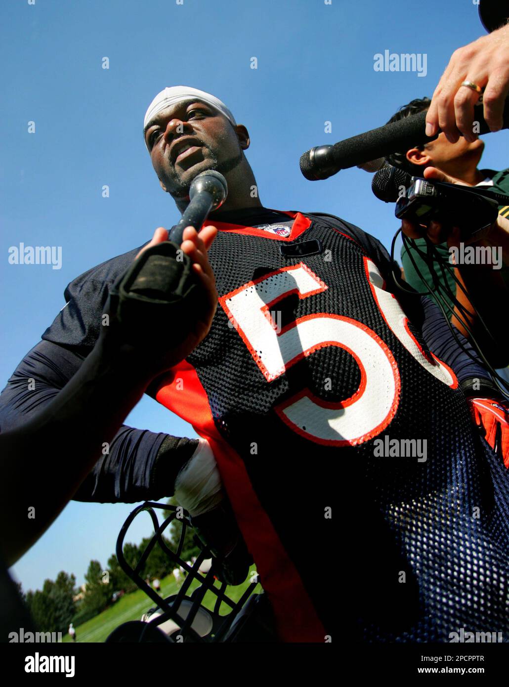 Denver Broncos linebacker Al Wilson stretches before taking part