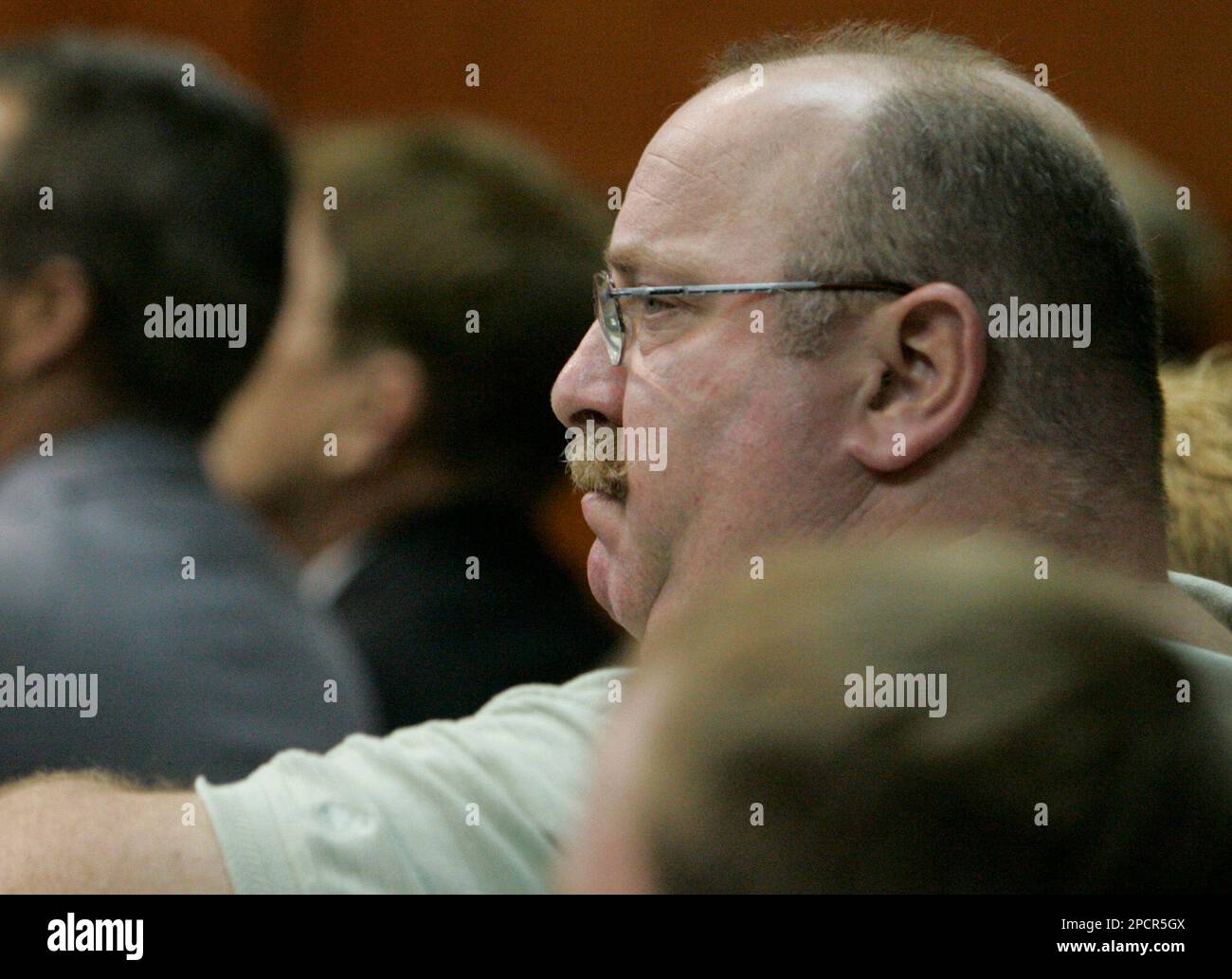 Bill belanger father of erin belanger one of six murder victims looks