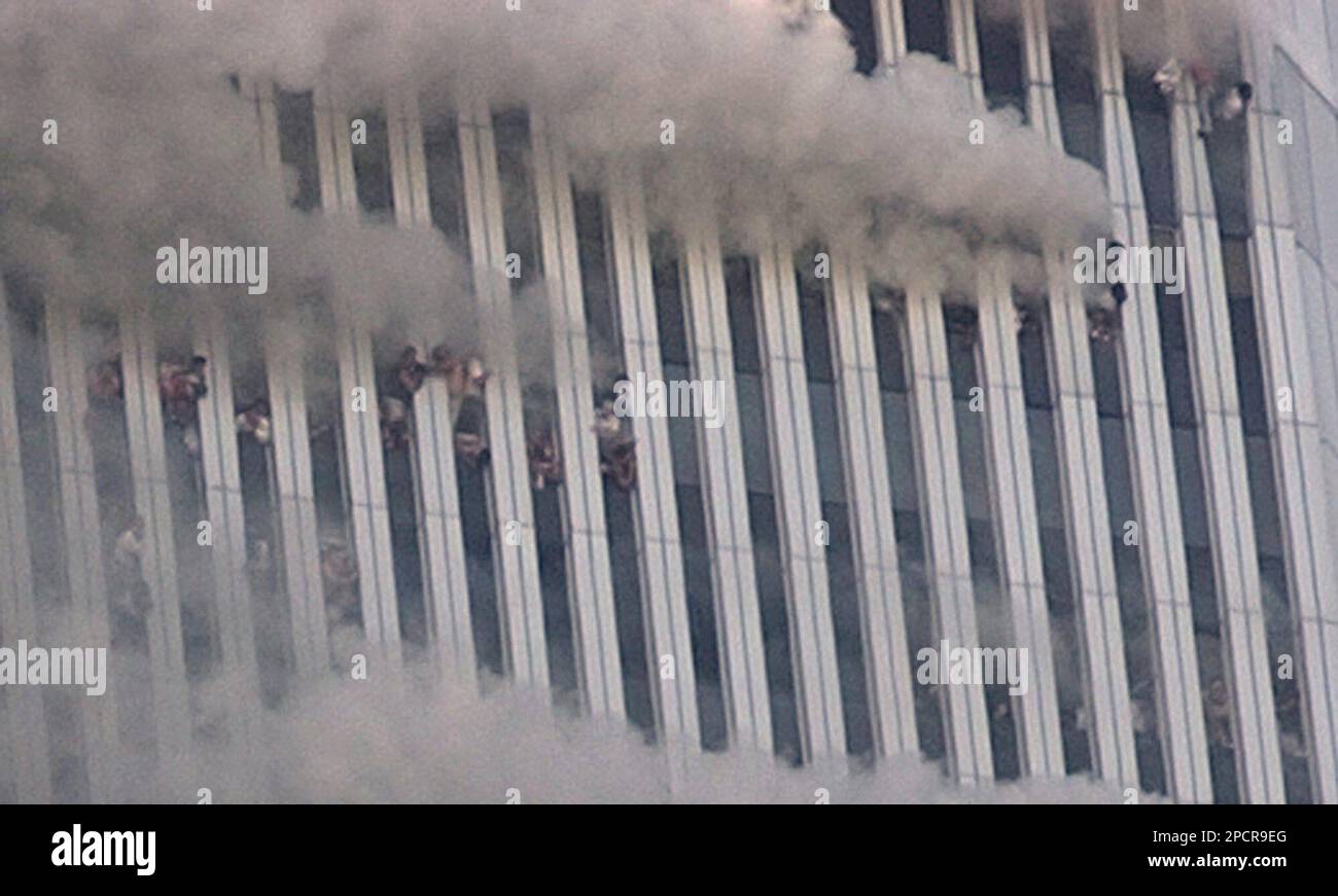https://c8.alamy.com/comp/2PCR9EG/file-people-hang-out-of-broken-windows-of-the-north-tower-of-the-world-trade-center-after-a-terrorist-attack-in-new-york-on-the-morning-of-sept-11-2001-richard-pecorella-has-spent-years-searching-for-an-image-he-says-will-bring-him-peace-a-photograph-that-proves-his-fiancee-whom-he-believes-could-be-in-this-photo-jumped-to-her-death-from-the-burning-world-trade-center-ap-photoamy-sancetta-file-2PCR9EG.jpg