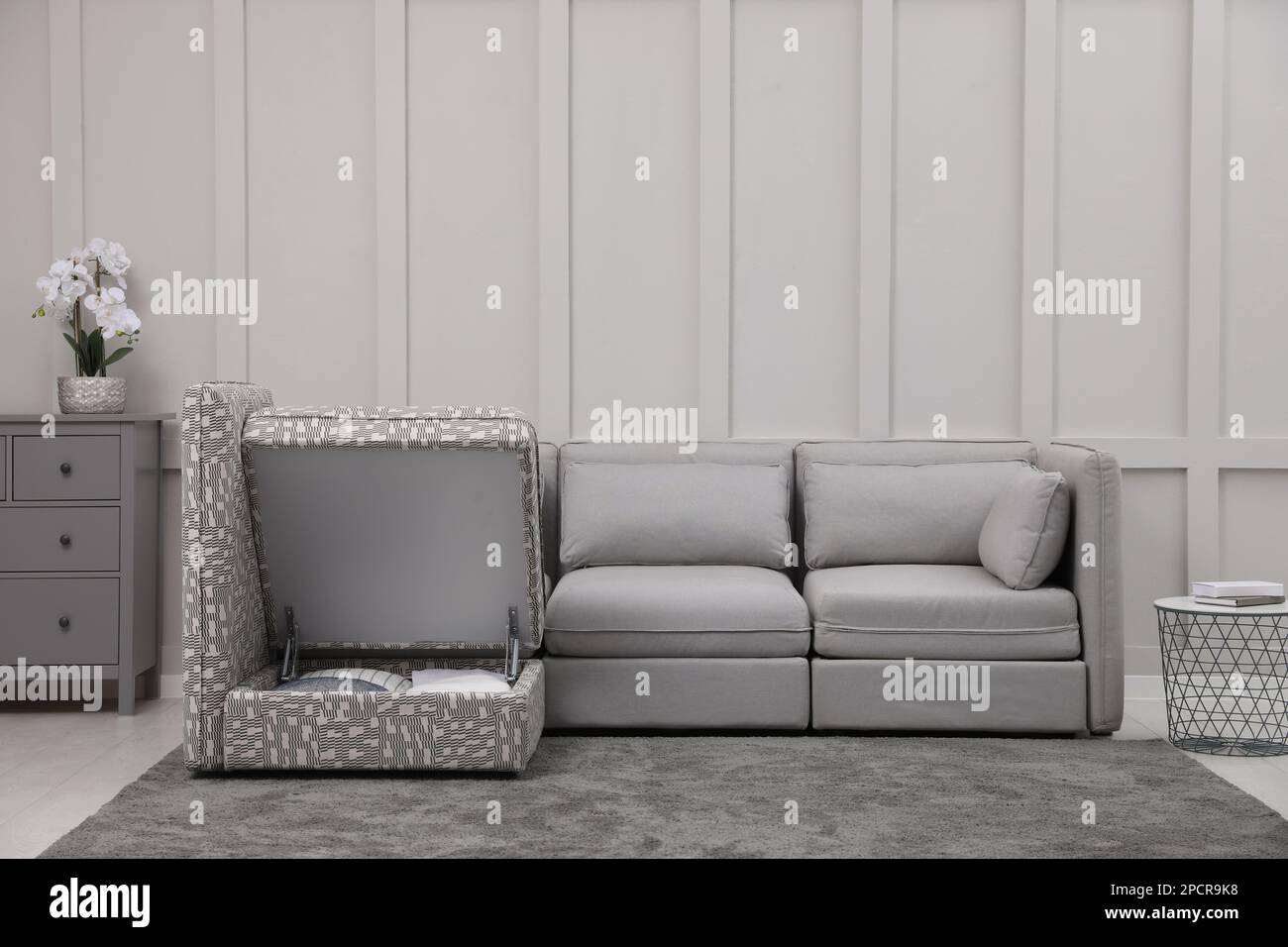 Modular sofa in living room, open section with storage. Interior design ...