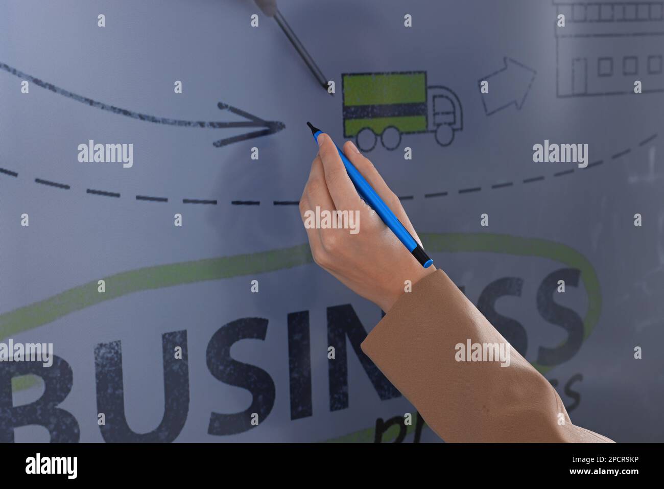 Business trainer with pen using interactive board, closeup Stock Photo