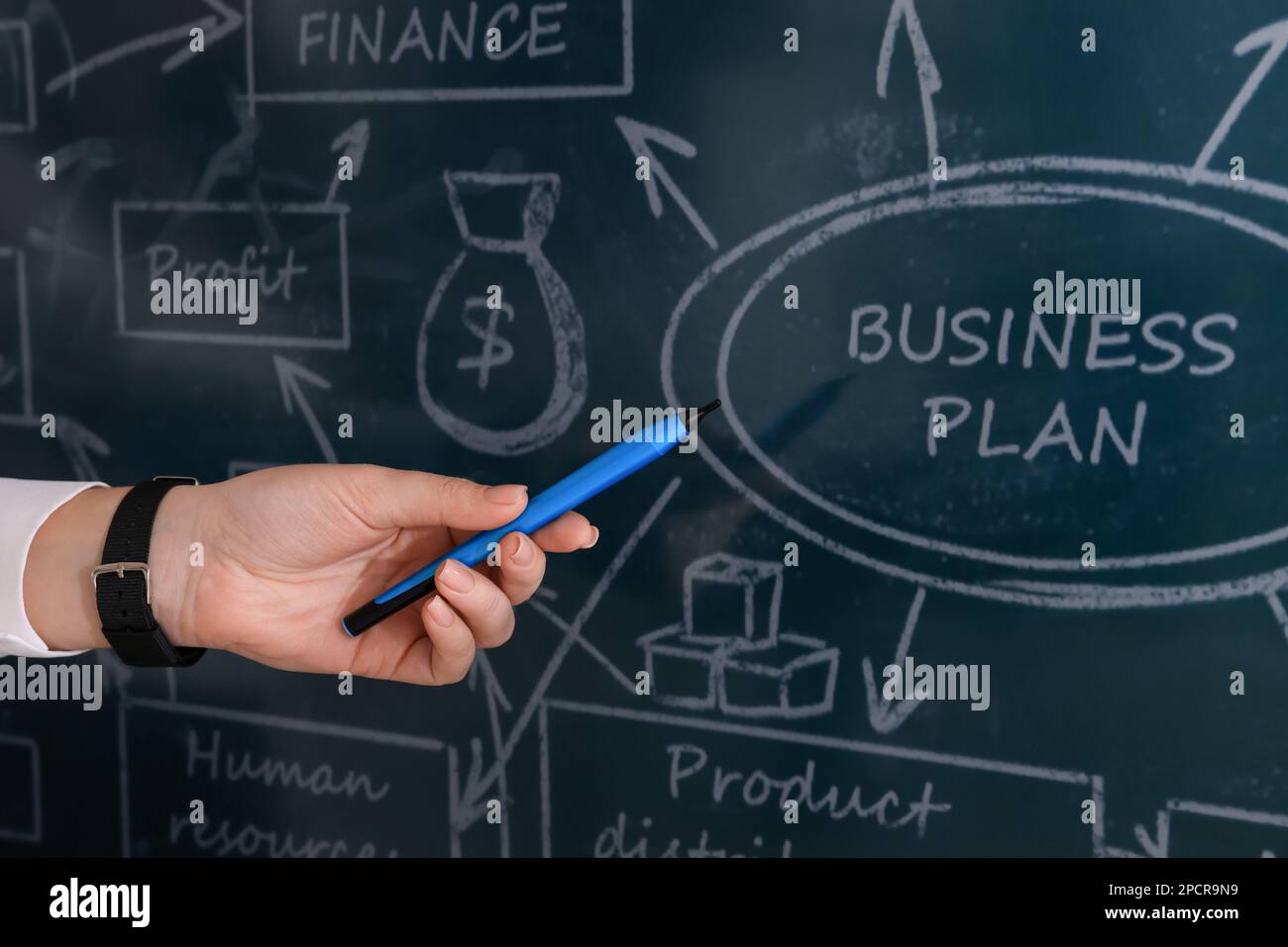 Business trainer with pen using interactive board, closeup Stock Photo