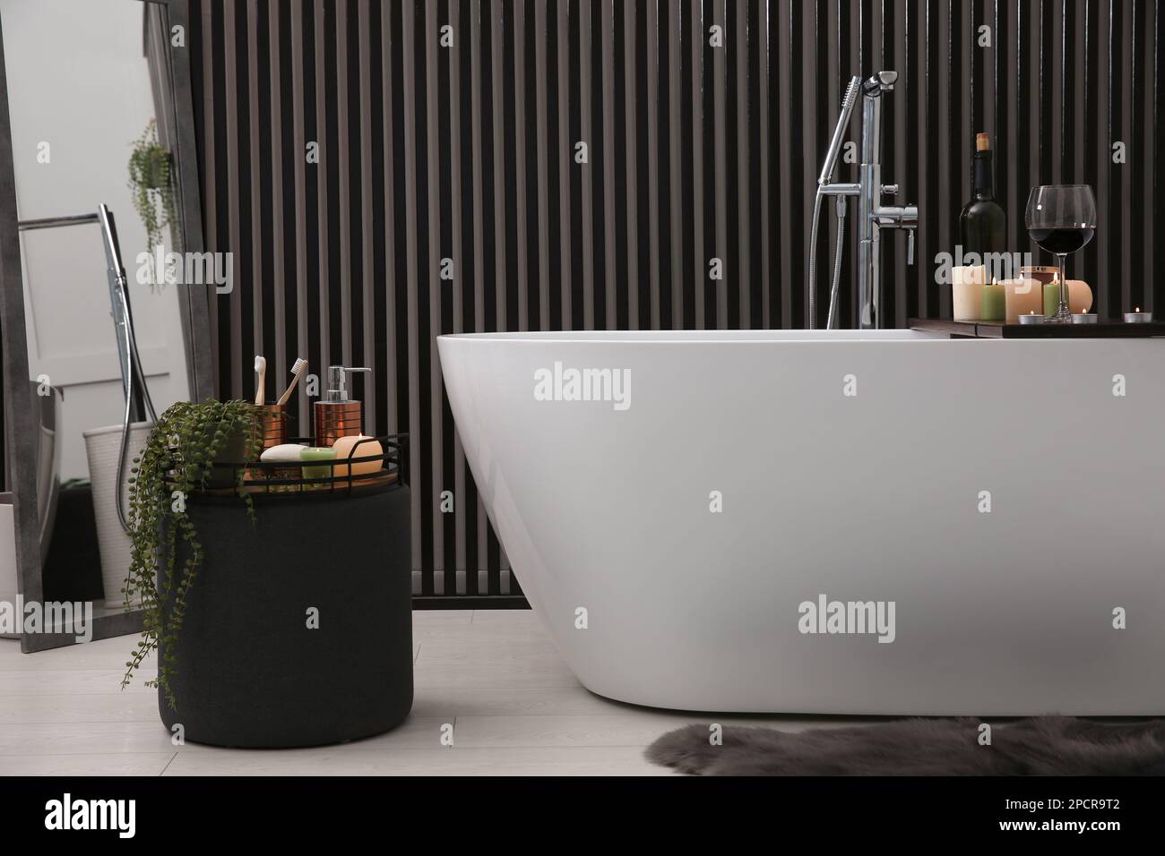Stylish bathroom interior with modern white tub Stock Photo - Alamy