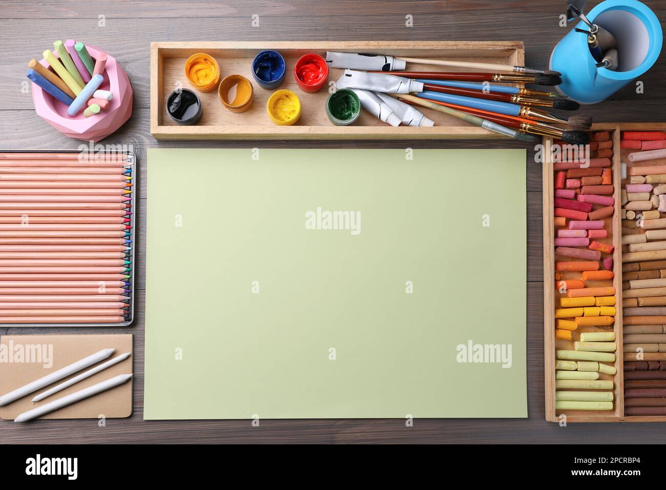 Soft pastels for artists and drawing paper on the wooden table Stock Photo  - Alamy