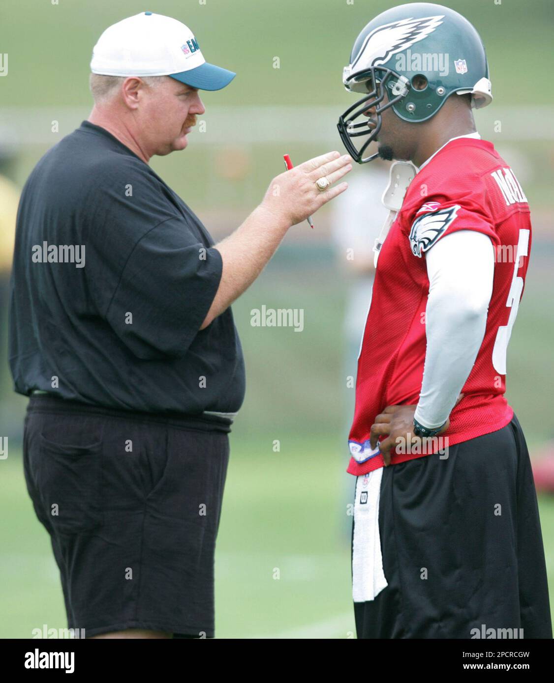 Philadelphia Eagles head coach Andy Reid talks with quarterback Donovan McNabb during football