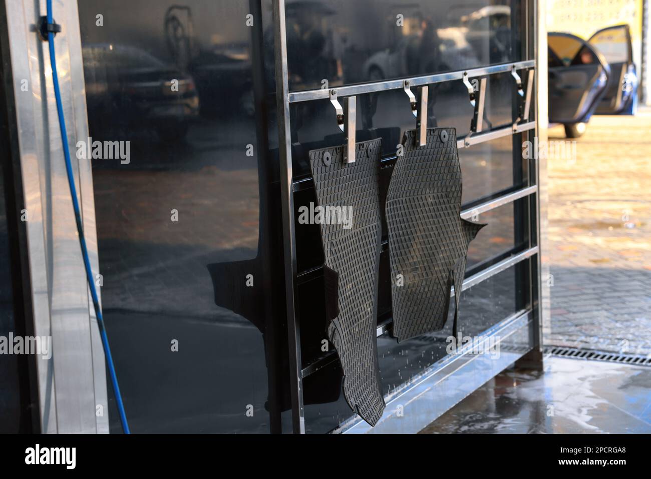 Dirty auto mats hanging at car wash Stock Photo Alamy