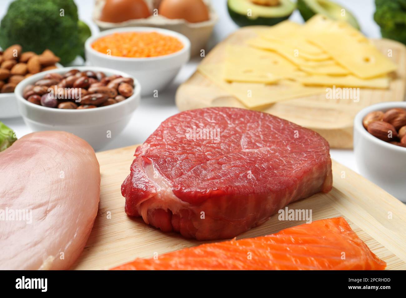 Fresh meat and other products on table, closeup. Sources of essential