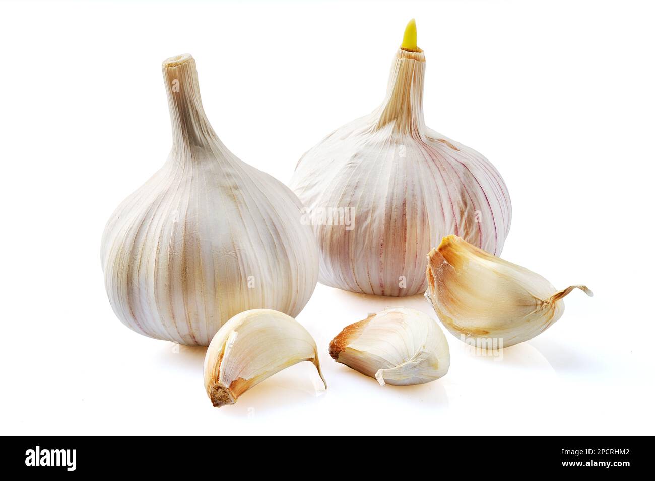 Two bulbs of garlic and three cloves isolated on white background Stock ...
