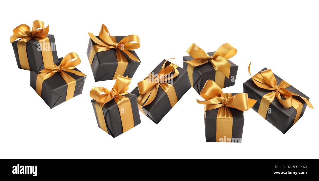 Beautifully wrapped gift boxes flying on white background Stock Photo