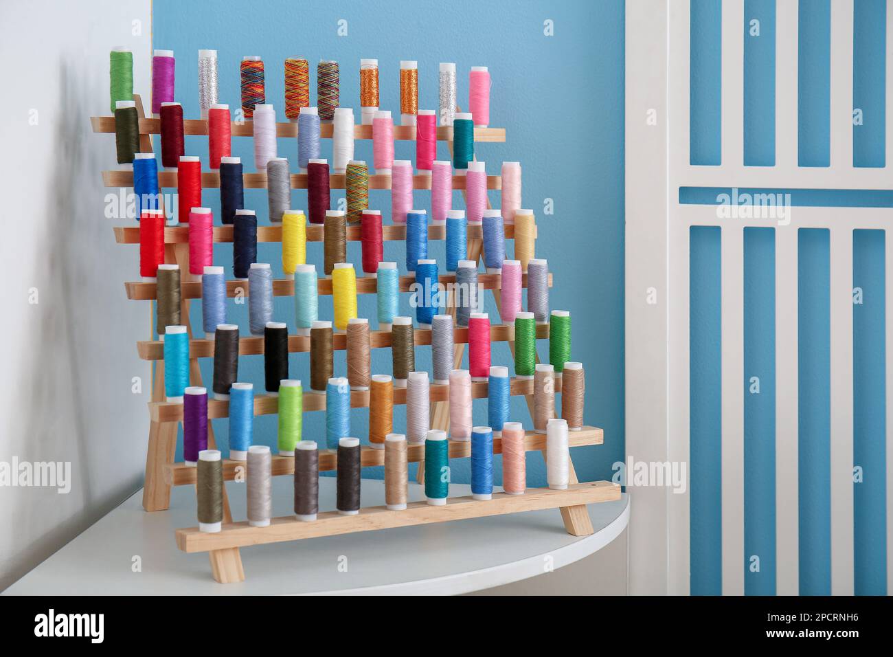 Blue spools threads in workshop hi-res stock photography and images - Alamy