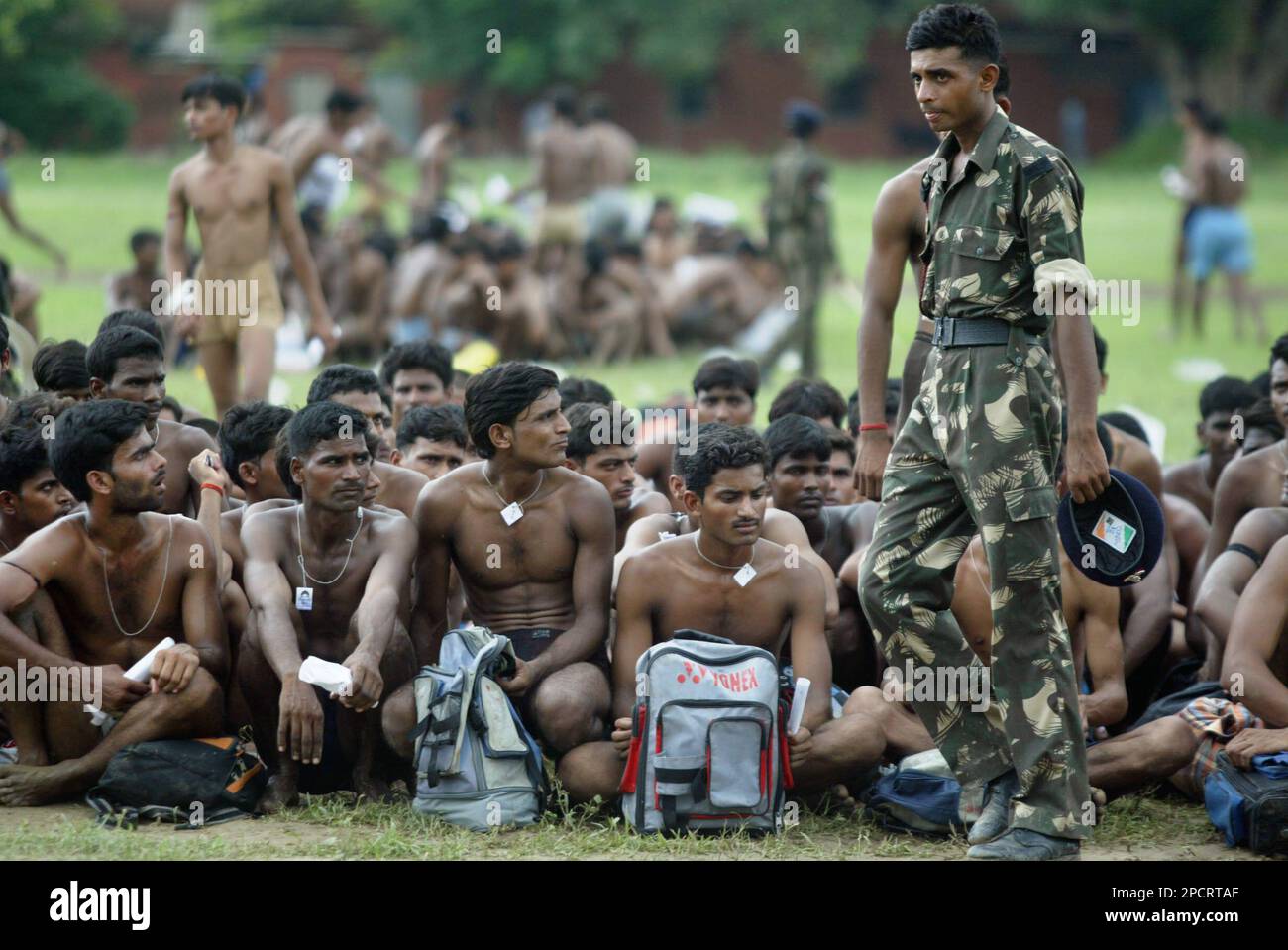 Prospective army candidates await their turn to perform physical 