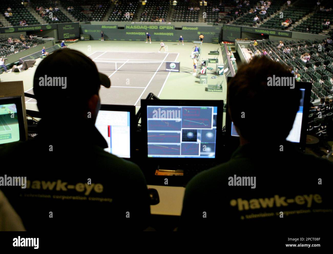 FILE ** Technicians with the Hawk-Eye electronic system monitor computer screens used in instant replay at the Nasdaq 100 Open tennis tournament in Key Biscayne, Fla., in this March 22, 2006