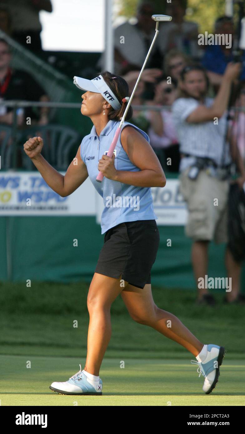 Golfer Mi Hyun Kim, of South Korea, pumps her fist after sinking the