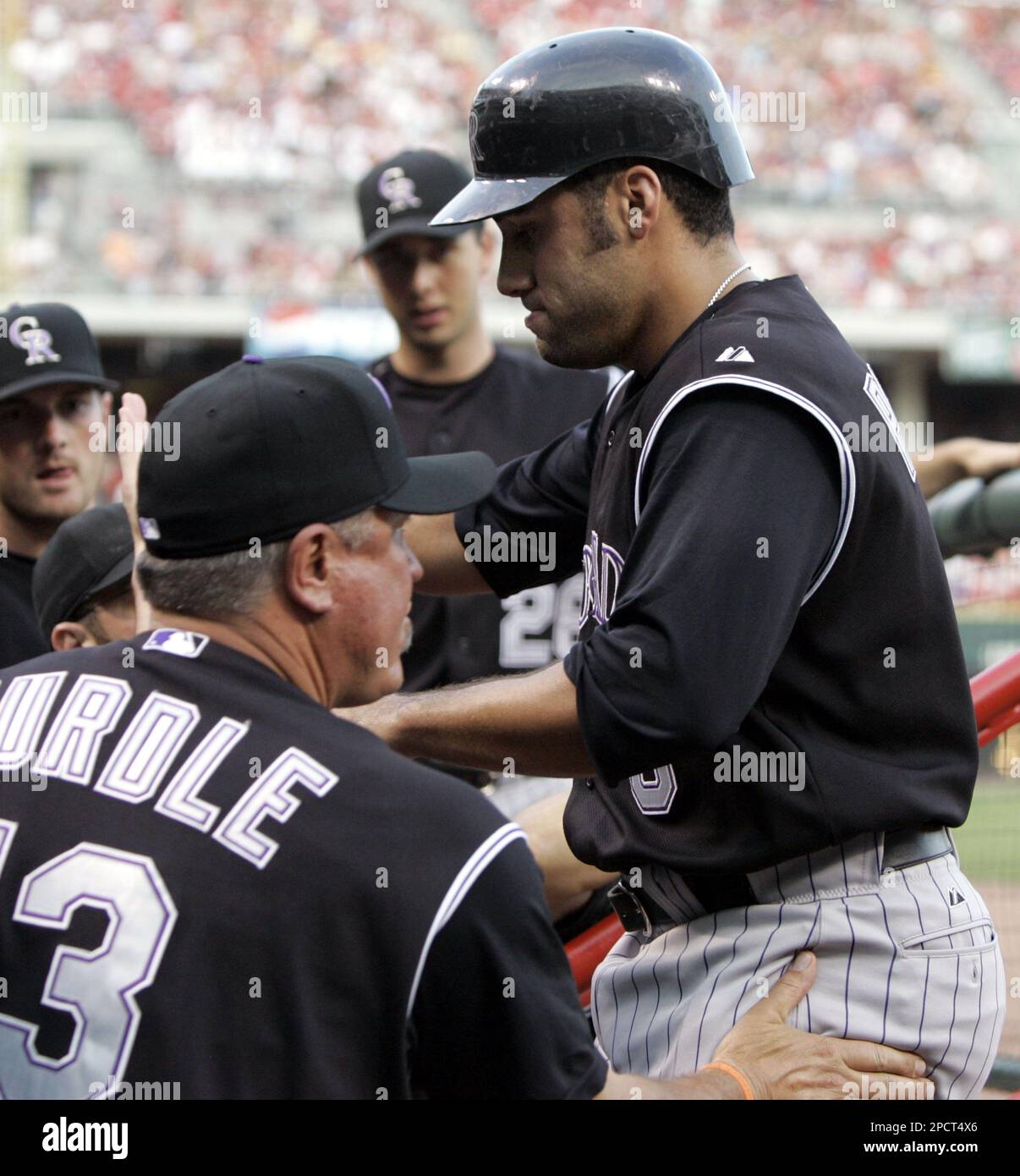 Colorado Rockies' Piedra, right, is congratulated by manager