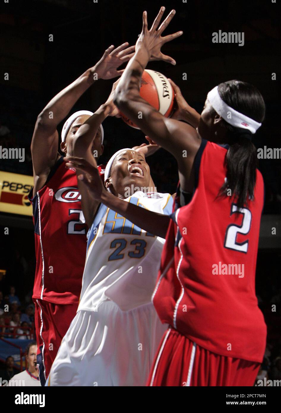 Chicago Sky's Deanna Jackson, center, heads to the basket past Houston