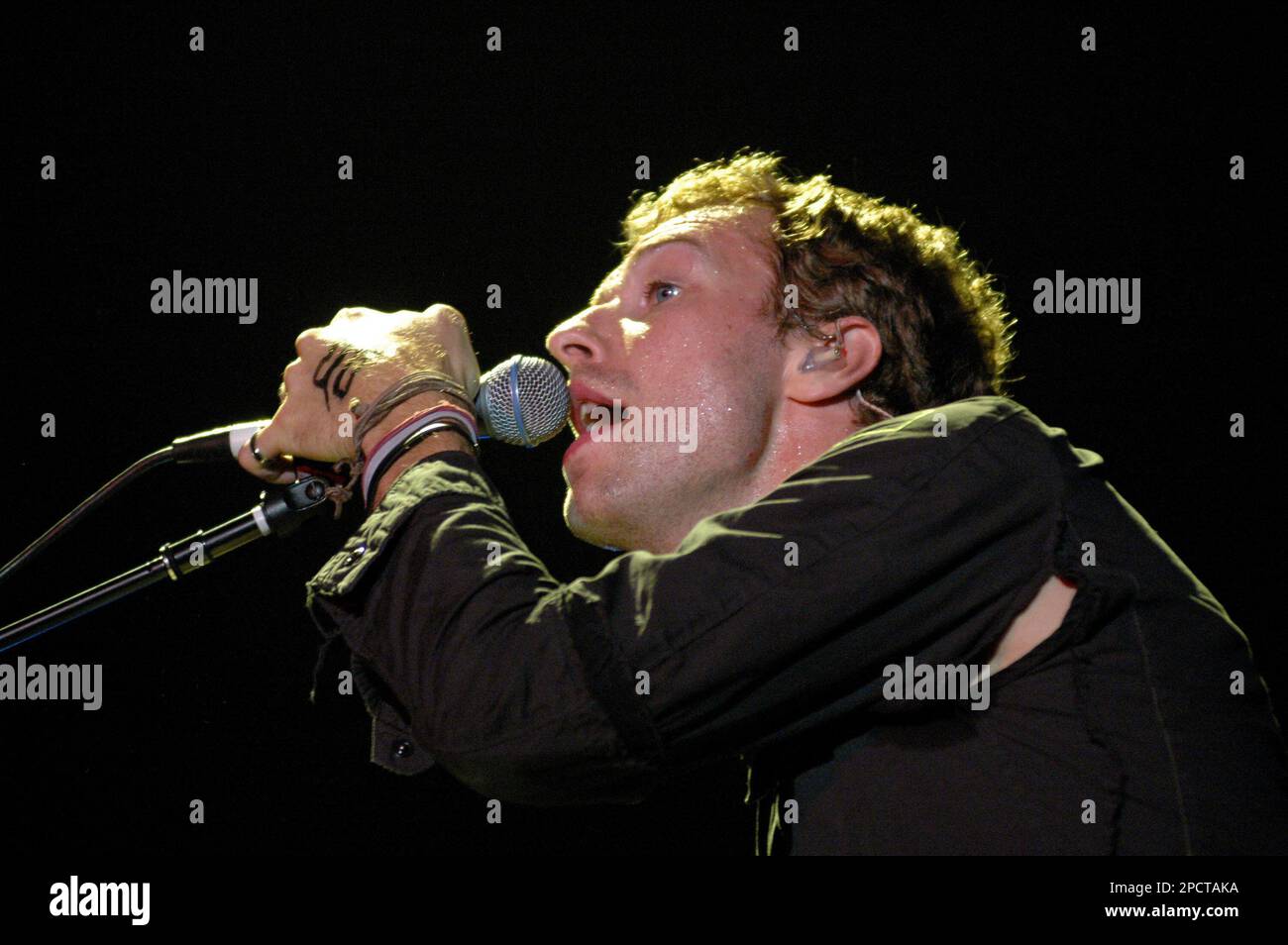Coldplay members performing in ${year}