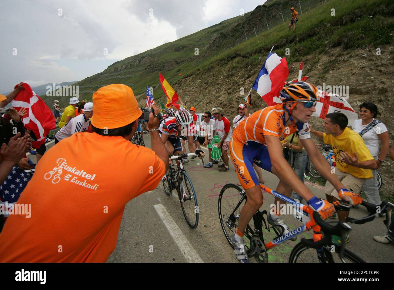 Stage winner Denis Menchov of Russia, right, and Cadel Evans of Australia,  rear, climb Puerto de Beret pass during the 11th stage of the Tour de France  cycling race between Tarbes, southwestern
