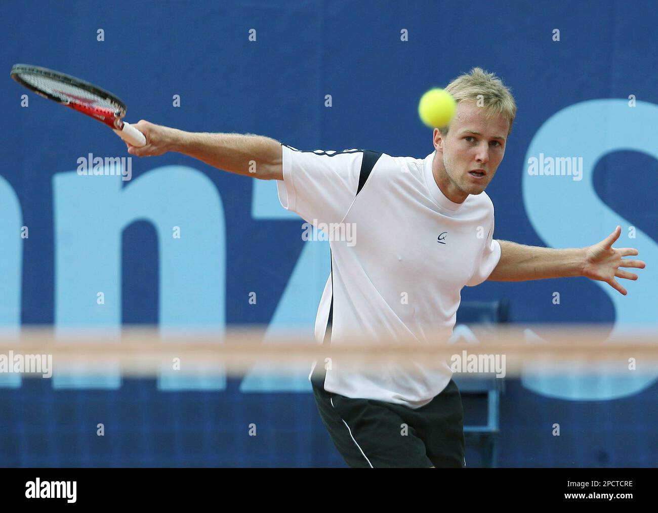 Christophe Rochus from Belgium returns a ball to Gaston Gaudio from  Argentina, during their match at the Allianz Suisse Open tennis tournament  in Gstaad, Thursday, July 13, 2006. (KEYSTONE/ Peter Schneider Stock