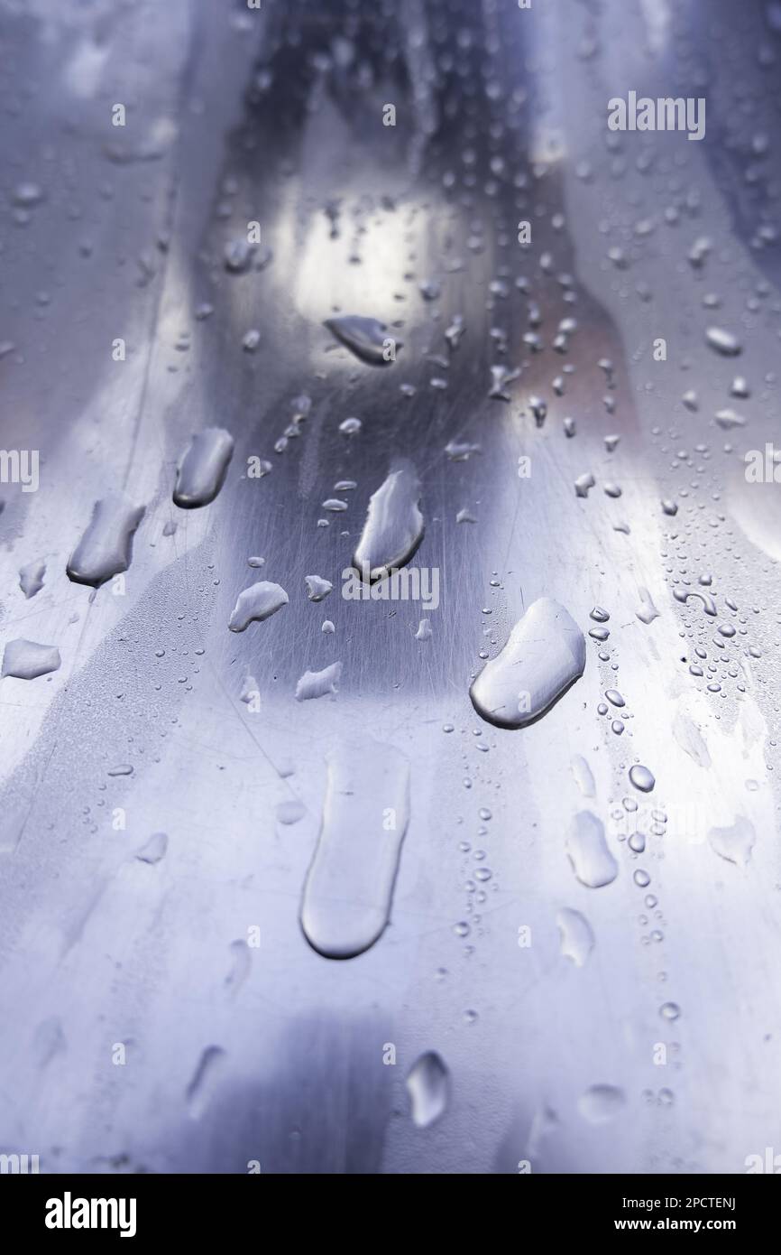 Detail of stainless steel surface wet from the rain Stock Photo